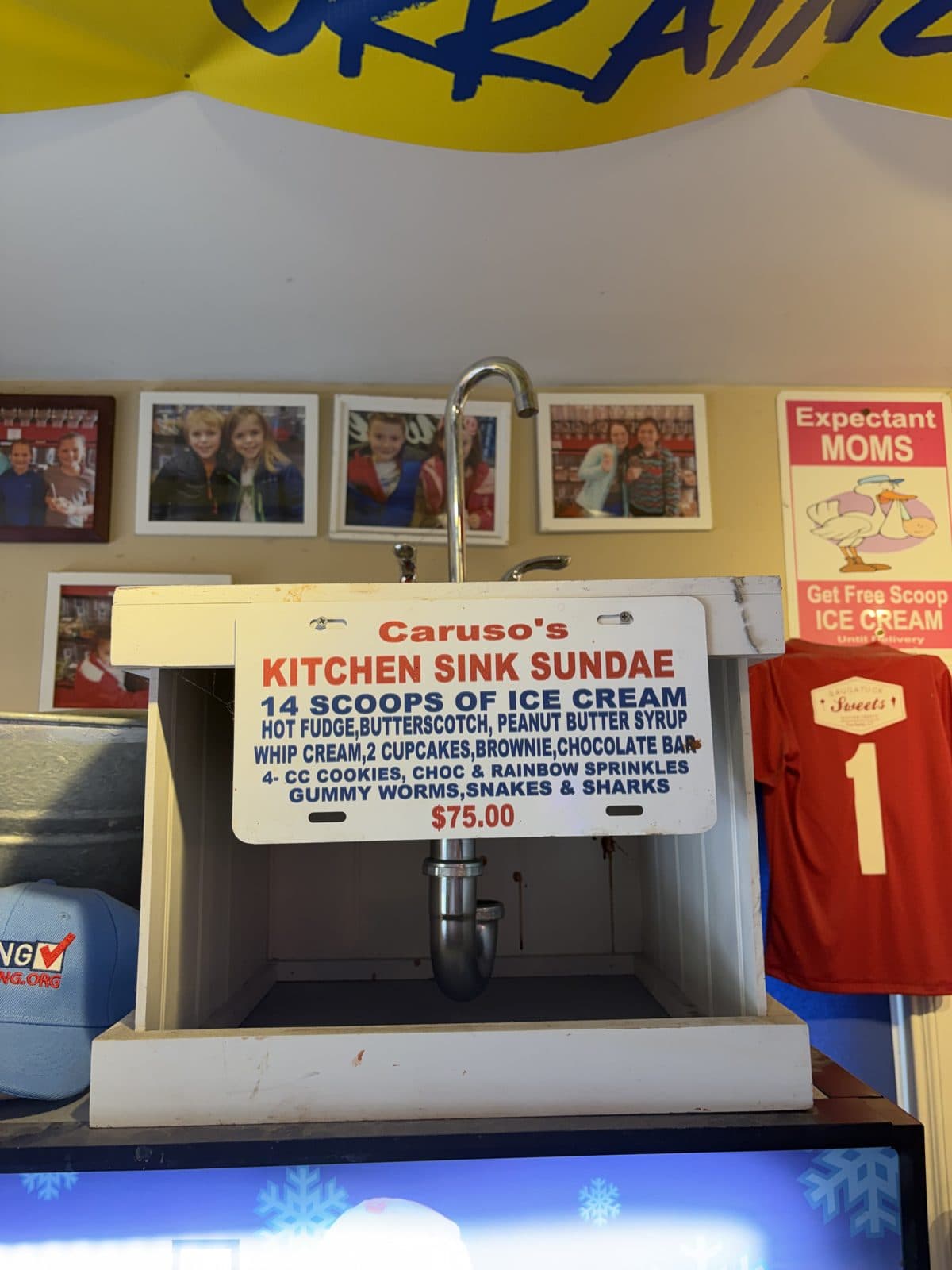 The Kitchen Sink Sundae sign — 14 scoops of ice cream